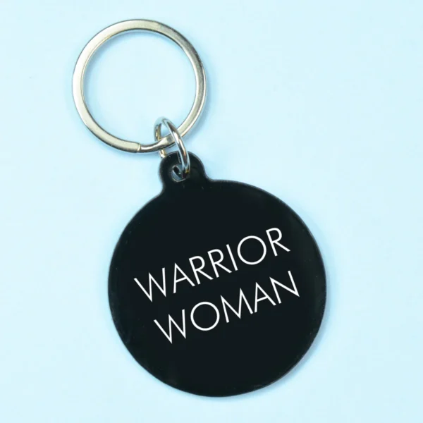 Warrior woman acrylic keyring blue background