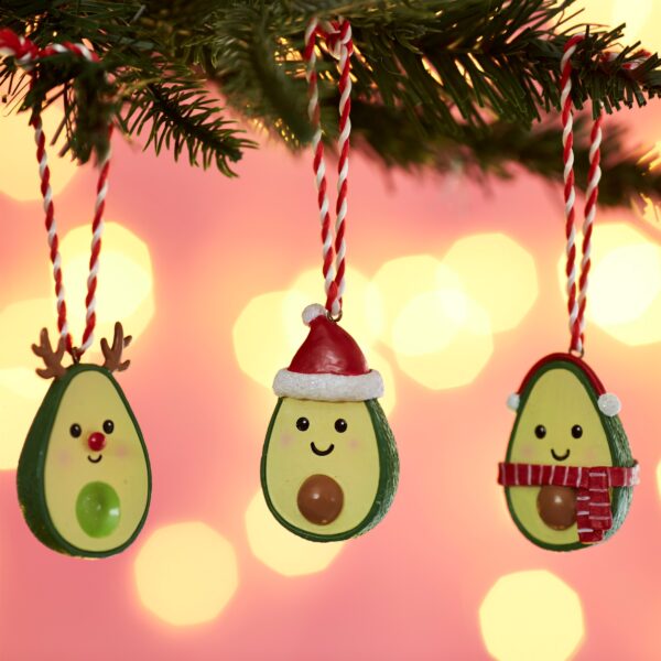 Festive Christmas Avocado three baubles hanging on tree lifestyle