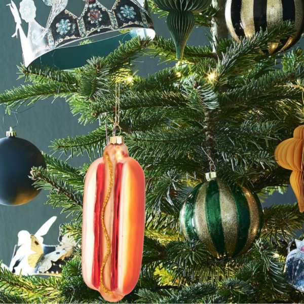 Hot dog christmas bauble on tree lifestyle