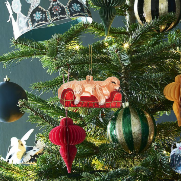 Pampered dog festive bauble lifestyle on christmas tree