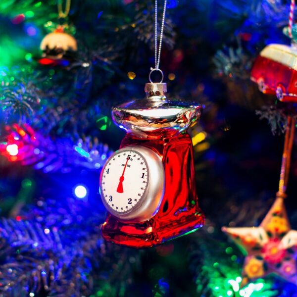 Retro kitchen scales Christmas bauble decoration lifestyle on christmas tree